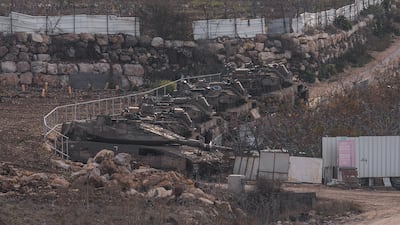 Israeli tanks assemble near the buffer zone that separates the Israeli-annexed Golan Heights from Syria. AP