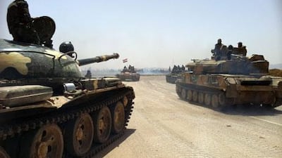 Syrian army tanks making their way to a military airfield north of Qusayr yesterday. AFP