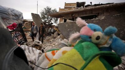 Syrians salvage some of their belongings from the rubble of houses hit in the western countryside of the northern province of Aleppo. AFP