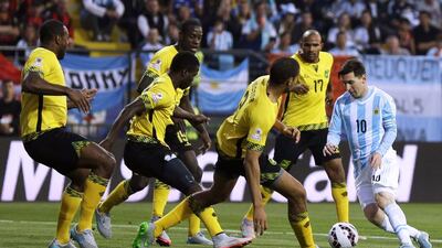 Surrounded by Jamaican players, Argentina's Lionel Messi, right, controls the ball during the Copa America Group B match at the Sausalito Stadium in Vina del Mar, Chile, on June 20, 2015. Natacha Pisarenko / AP Photo
