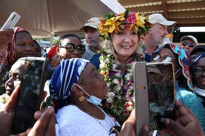 Marine Le Pen poses with supporters during her election campaign visit at the Mamoudzou square in Mayotte in December 2021. AFP