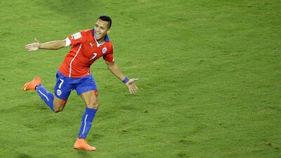 Chile's Alexis Sanchez celebrates after his goal gives Chile the 1-0 lead over Australia on Friday night at the 2014 World Cup in Cuiaba, Brazil. Michael Sohn / AP