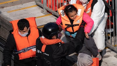 A migrant family arrives in Dover. Getty Images