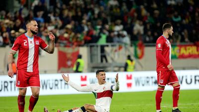 Portugal's Cristiano Ronaldo, centre, reacts after being fouled. AP