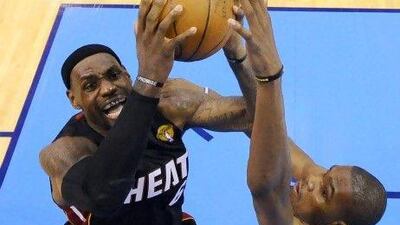 LeBron James, left, defended here by Oklahoma City Thunder's Kevin Durant, has been outstanding in the opening two games of the NBA finals. And Durant has been just as good.