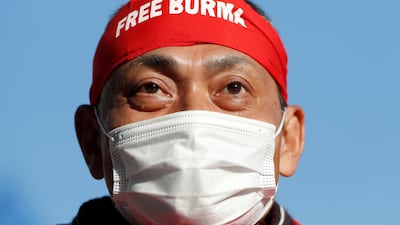 A man wearing a “Free Burma" headband protests at United Nations University in Tokyo against Myanmar's military, after it seized power on Monday, February 1. Reuters