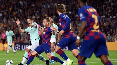 Inter Milan's Stefano Sensi, left, vies with Barcelona's Arthur. AFP