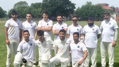 The London Tigers second XI huddle together during a match at Vale Farm sports fields in Wembley. The team is run and sponsored by a Bangladeshi, is captained by an Indian, and also includes Pakistanis, three Afghans, and two Nepalese. Paul Radley / The National