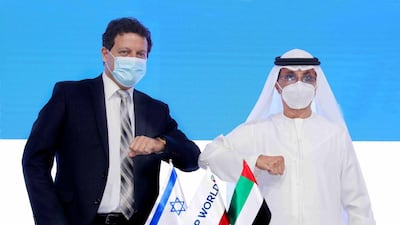 DP World's chairman and chief executive Sultan Ahmed Bin Sulayem (right) bumps elbows with Bank Leumi's chairman Dr Samer Haj Yahia after signing the agreement in Dubai. Courtesy of DP World