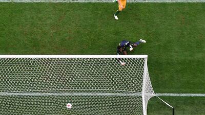 Australia's midfielder Mark Milligan shoots to score in a penalty during their Confederations Cup group B match against Cameroon at the St Petersburg Stadium on Thursday. Mladen Antonov / AFP