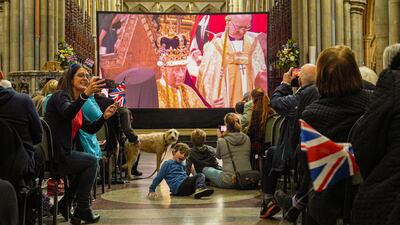 People watch a live screening of the coronation, inside Truro Cathedral, England. Getty Images