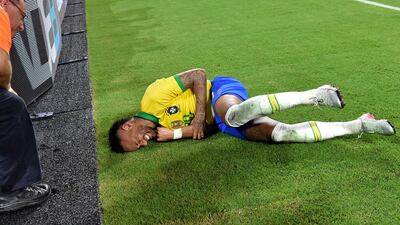 Neymar writhes in pain after after colliding with the boards on the side of the pitch. Credit: Steve Mitchell-USA TODAY Sports