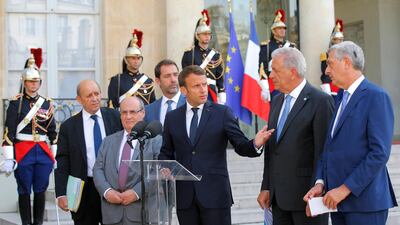 French Foreign Minister Jean-Yves Le Drian, Director of the United Nations Migration Agency Antonio Manuel de Carvalho Ferreira Vitorino, French Interior Minister Christophe Castaner, French President Emmanuel Macron, European Commissioner for Migration and Home Affairs Dimitris Avramopoulos and United Nations High Commissioner for Refugees (UNHCR) Filippo Grandi. AP