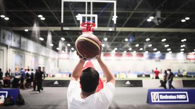 Inside of Saeed Hall at the Dubai World Trade Centre, residents can come and play sports without enduring the summer heat. Here, one resident plays basketball on June 21, 2015. Lee Hoagland / The National