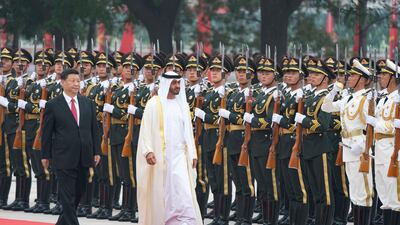HH Sheikh Mohamed bin Zayed, Crown Prince of Abu Dhabi and Deputy Supreme Commander of the Armed Forces (R) and Xi Jinping, President of China (L), inspect the Guard of Honour during a reception, at the Great Hall of the People in Beijing, China on July 22, 2019. Hamad Al Mansoori for the Ministry of Presidential Affairs