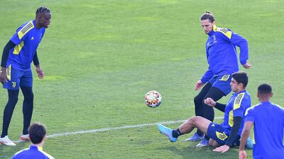 Juve's Adrien Rabiof, third from right, and Dennis Zakaria, left, during training. EPA
