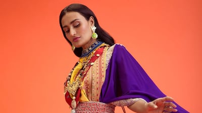 A lehenga with dual-draped dupattas cinched with a cummerbundfrom Anamika Khanna