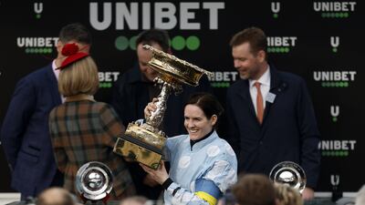 Jockey Rachael Blackmore receives the trophy. PA
