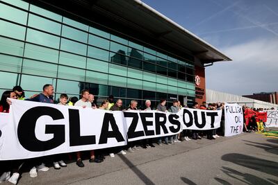 Manchester United fans protest outside Old Trafford, holding 'Glazers Out' banners on October 07, 2023 in Manchester, England. Getty