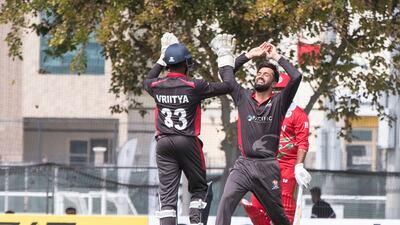 UAE players celebrate an Oman wicket during the Cricket World Cup League 2 match at the ICC Academy in Dubai.