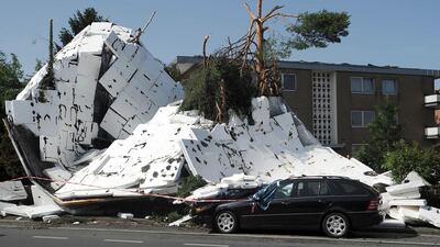 Storms in France, Germany and Belgium in June caused losses amounting $2.7 billion, with $2.5bn of that covered by insurers. Above, the remains of a flat roof lie on the ground in Neuss, Germany. Henning Kaiser / EPA