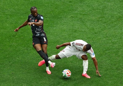 Qatar's Assim Madibo, right, fouls Canada's Ismael Kone before being shown a red card. Reuters