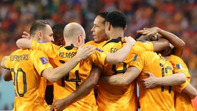Cody Gakpo celebrates with teammates after scoring. EPA