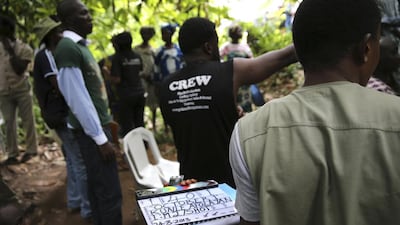Crew members work while filming police thriller ‘October 1’ at a rural location in Ilaramokin village, southwest Nigeria.