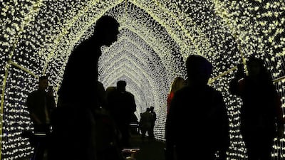 People at the Palm Oasis near Al Noor Masjid during the Sharjah Light Festival in Sharjah. Pawan Singh / The National