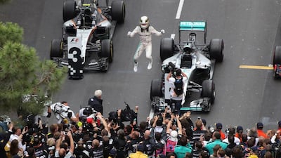 Lewis Hamilton celebrates with his team after winning the Monaco Grand Prix. Valery Hache / AFP