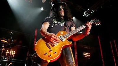 Slash performs with his band Velvet Revolver. Jeremy Craine / Rex Features