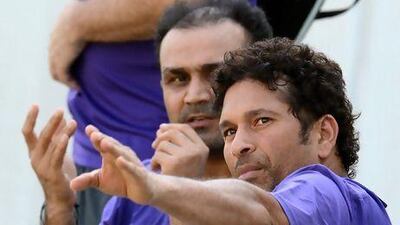 Sachin Tendulkar, right, retired from the India ODI team after 23 years. Punit Paranjpe / AFP