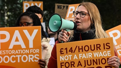 A demonstrator speaks during a protest by junior doctors at Saint Mary's Hospital in Manchester. AFP