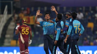 Sri Lanka players celebrate the dismissal of West Indies captain Kieron Pollard during the T20 World Cup match in Abu Dhabi. AP