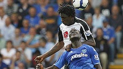 Portsmouth's Papa Bouba Diop, bottom challenges Fulham's Dickson Etuhu during Pompey's opening day defeat at Fratton Park.