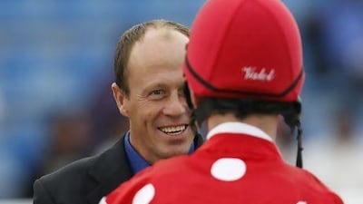 Ernst Oertel, the South African trainer, seen here speaking with the jockey Ted Duncan, has saddled 16 winners and seen Dh1.8million in winnings since taking over Al Asayl Stables 12 months ago. Mike Young / The National
