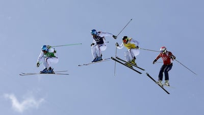 Left to right: Jean Frederic Chapuis of France, Arnaud Bovolenta of France, Jonathan Midol of France and Brady Leman of Canada float through the air during the Men's Ski Cross Final at Rosa Khutor Extreme Park in Krasnaya Polyana, Russia, on February 20, 2014. VALDRIN XHEMAJ / EPA