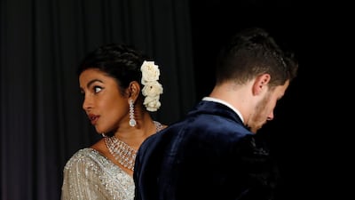 Newlyweds Priyanka Chopra, 36, and Nick Jonas, 26, pose for a photograph during a reception at a hotel in New Delhi on December 4, 2018. Photo: Reuters