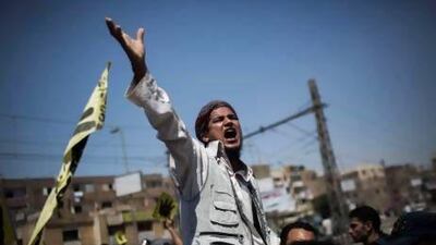 A supporter of Mohammed Morsi chants slogans against the Egyptian army during a march following Friday prayers at Nasr City in Cairo.