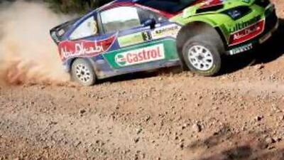 Finland's Mikko Hirvonen and Jarmo Lehtinen skid round a corner on a special stage of the Acropolis Rally in Aghii Theodori, Greece.