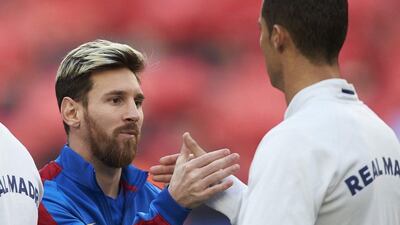 Barcelona’s Lionel Messi and Real Madrid’s Cristiano Ronaldo shake hands before the match. Alejandro Garcia / EPA