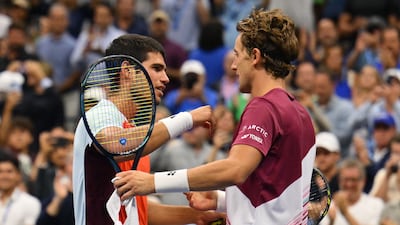 Norway's Casper Ruud, right, congratulates Spain's Carlos Alcaraz after winning the 2022 US Open final. AFP