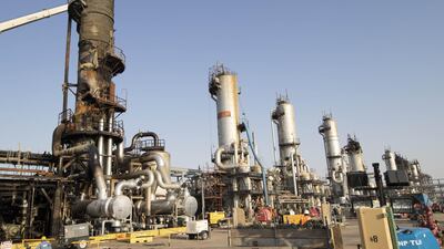 Workers repair a damaged refining tower at Saudi Aramco's Abqaiq crude oil processing plant following an attack in Abqaiq, Saudi Arabia. Bloomberg
