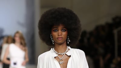 A fluid all-white kaftan on the runway as part of the Chanel cruise 2021-22 show in Dubai