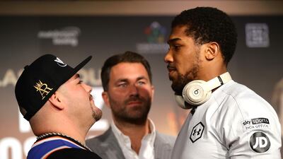 Eddie Hearn stands between Andy Ruiz Jr and Anthony Joshua during the 'Clash on the Dunes' press conference in Diriyah. Getty