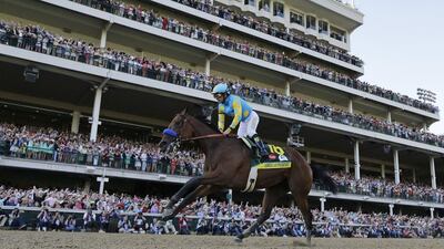 Victor Espinoza rides American Pharoah to victory in the 141st running of the Kentucky Derby horse race on Saturday in the US. David J Phillip / AP / May 2, 2015