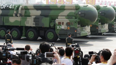 Military vehicles carrying DF-41 intercontinental ballistic missiles travel past Tiananmen Square. Reuters