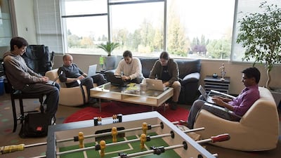 Google software engineers work in a room with a view and a foosball table at Google Kirkland in Washington, which also includes amenities such as a climbing wall, gym and soda fountain. Stephen Brashear / Getty Images / AFP