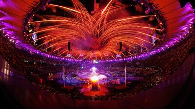 ireworks light up the stadium as the Paralympic Cauldron burns during the Opening Ceremony. Mike Ehrmann/Getty Images