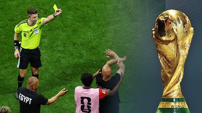 Soccer Football - FIFA World Cup 2026 - Round of 16 - Argentina v Egypt - Atlanta Stadium, Atlanta, Georgia, U. S. - July 7, 2026 Egypt coach Hossam Hassan is shown a yellow card by referee Francois Letexier as he makes anti-racism gesture REUTERS / Marco Bello TPX IMAGES OF THE DAY